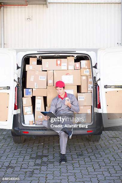 courier delivering parcels and boxes - full responsibility stock pictures, royalty-free photos & images