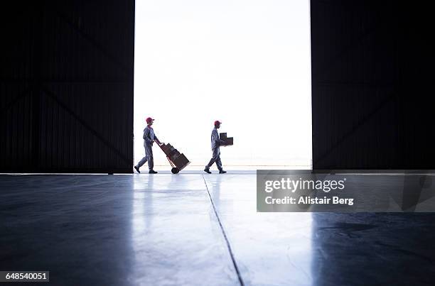 couriers delivering parcels and boxes - distribution warehouse stock pictures, royalty-free photos & images