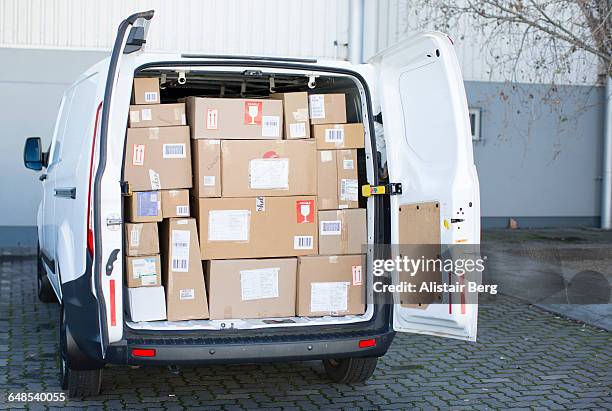 courier van full of parcels and boxes - lieferwagen stock-fotos und bilder