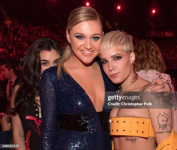 Musicians Kelsea Ballerini , Haley and Lauren Jauregui of music group Fifth Harmony pose at the 2017 iHeartRadio Music Awards which broadcast live on...