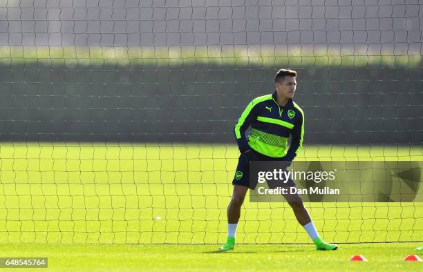 Striker Alexis Sanchez warms up during the Arsenal training session at London Colney on March 6, 2017 in St Albans, England.