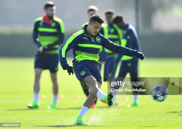 Striker Alexis Sanchez warms up during the Arsenal training session at London Colney on March 6, 2017 in St Albans, England.