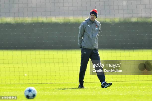 Arsenal manager Arsene Wenger watches over his players during the Arsenal training session at London Colney on March 6, 2017 in St Albans, England.
