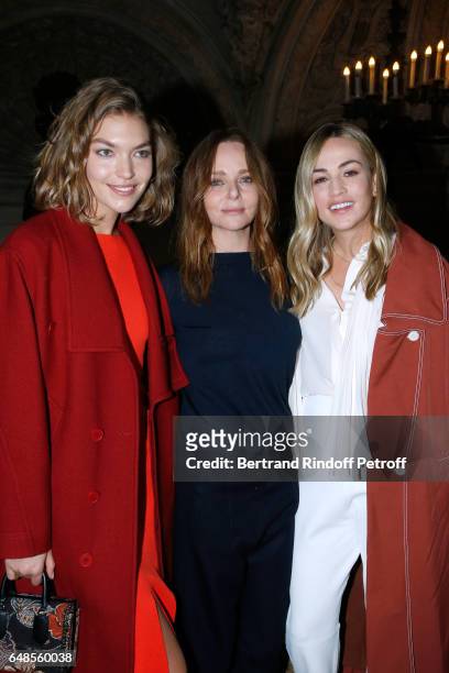 Stylist Stella McCartney standing between Formula One Driver, Carmen Jorda and Arizona Muse pose after the Stella McCartney show as part of the Paris...