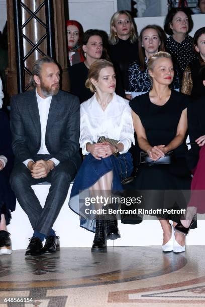 Husband of Stella, Alasdhair Willis, Natalia Vodianova and Pamela Anderson attend the Stella McCartney show as part of the Paris Fashion Week...