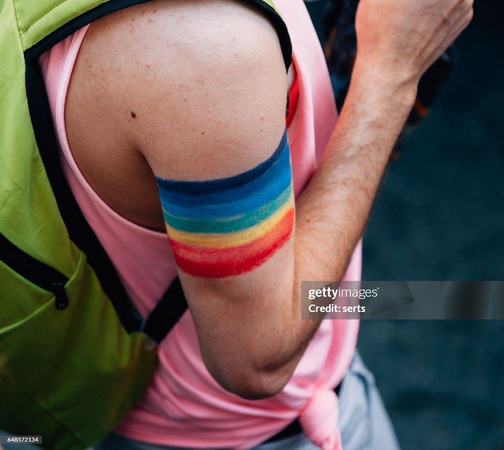 Rainbow flag sign on arm