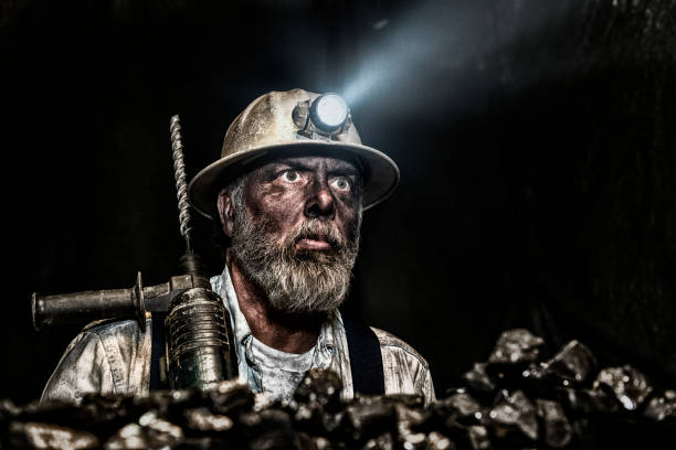 dirty coal miner wear hardhat with a hammer drill - coal mine stock pictures, royalty-free photos & images
