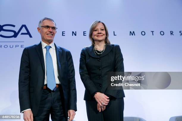 Chairman of the Managing Board of French carmaker PSA Group Carlos Tavares and Chairwoman and CEO of General Motors, Mary Barra pose prior to a press...