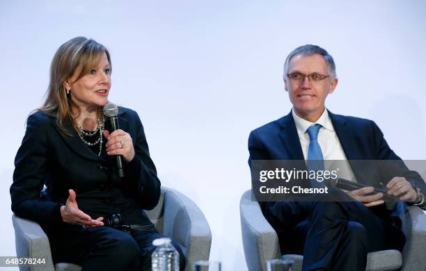 Chairman of the Managing Board of French carmaker PSA Group Carlos Tavares and Chairwoman and CEO of General Motors, Mary Barra attend a press...