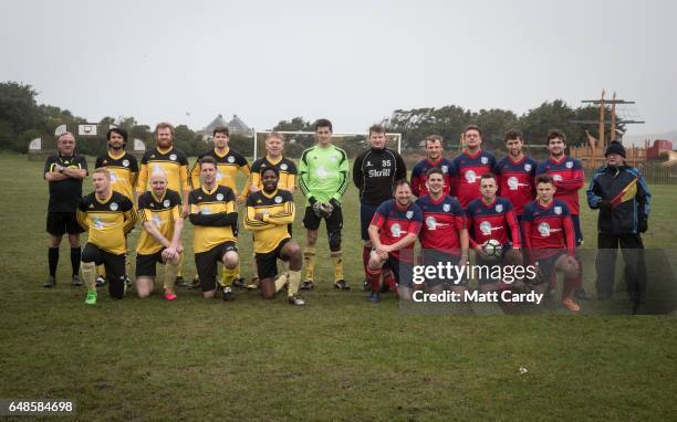 The Garrison Gunners and Woolpack Wanderers players and officials who had arrived by kick-off pose for a team picture before the game at the Garrison...