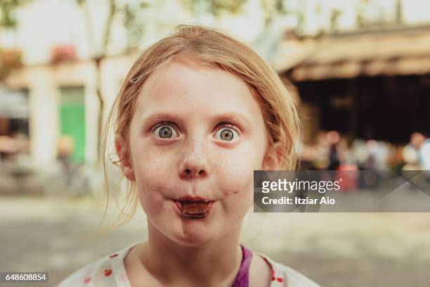 girl eating candy - candy on tongue stock pictures, royalty-free photos & images