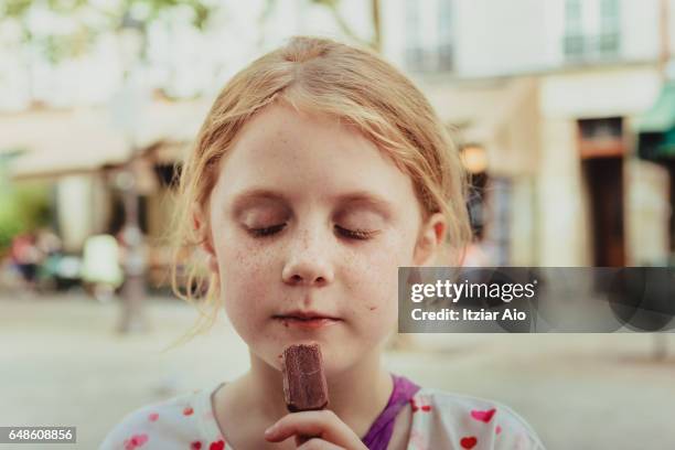 girl eating candy - candy on tongue stock pictures, royalty-free photos & images