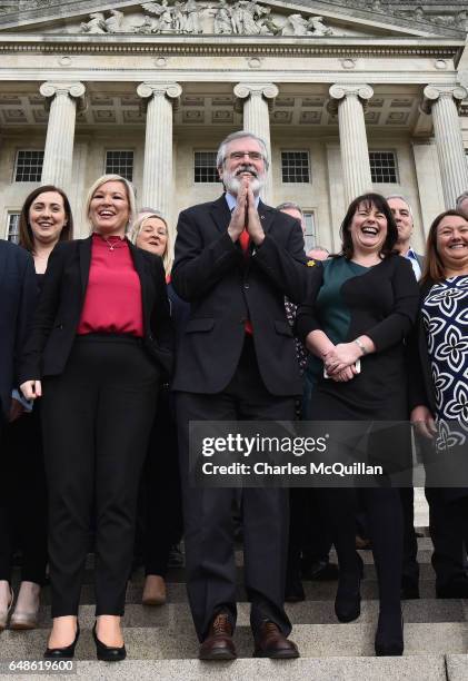 Sinn Fein president Gerry Adams bows to a group of Japanese tourists as he attends a press call alongside northern leader Michelle O'Neill and...