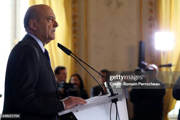 Former French prime minister, member of right-wing political party 'Les Republicains', Alain Juppe delivers a speech during a press conference at the...