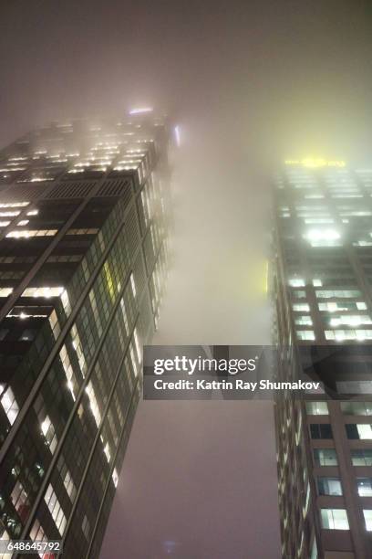 foggy night in big city - fog city stock pictures, royalty-free photos & images