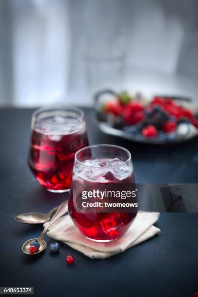 berry juice in drinking glass. - casis fotografías e imágenes de stock