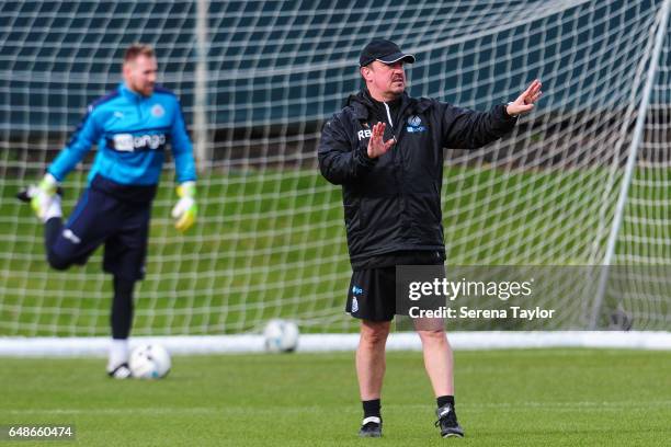 Newcastle United's Manager Rafael Benitez stands on the pitch giving instructions during the Newcastle United Training Session at The Newcastle...