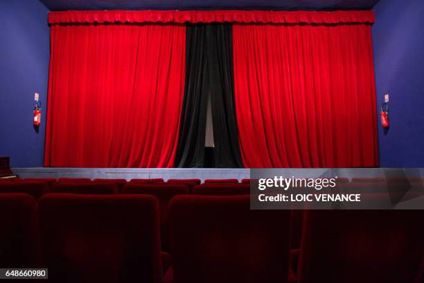 Picture taken on January 12, 2011 in Paris shows the furnishings and the curtain of the Studio 28 cinema theater. Lights were designed by French...