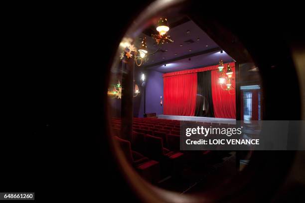 Picture taken on January 12, 2011 in Paris shows the furnishings and the curtain of the Studio 28 cinema theater. Lights were designed by French...