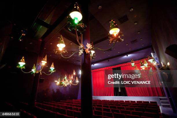 Picture taken on January 12, 2011 in Paris shows the furnishings and the curtain of the Studio 28 cinema theater. Lights were designed by French...