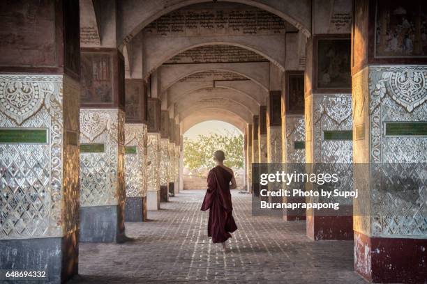 novice monk walking on mandalay hill , myanmar - pagoda stock pictures, royalty-free photos & images