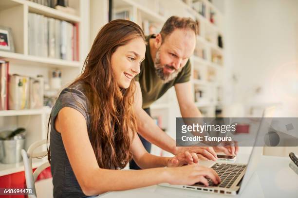 family moments, single father and daughter. - dad homework stock pictures, royalty-free photos & images