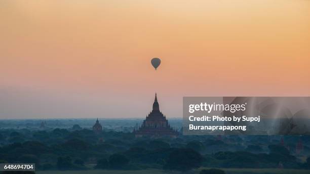 sulamani pagoda temple with hot air bolloon in the morining fog and sunrise before earthquake bagan , myanmar - bagan temples damaged in myanmar earthquake stock pictures, royalty-free photos & images