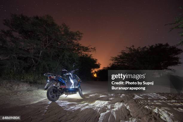 electric bike the popular vehicle in bagan , land of thousand pagoda , myanmar - bagan temples damaged in myanmar earthquake stock pictures, royalty-free photos & images