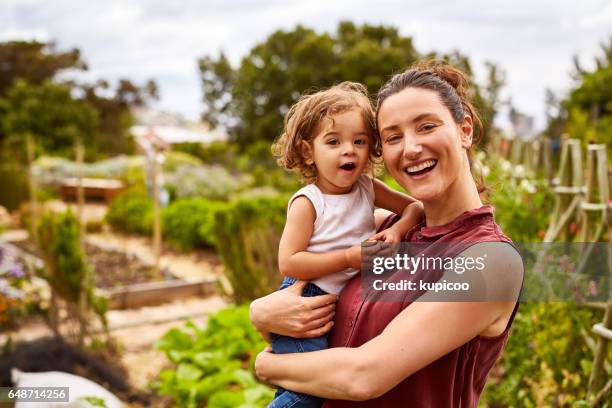 she already loves getting out into the garden - happy family in farm stock pictures, royalty-free photos & images