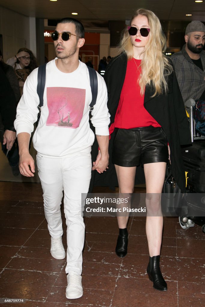 Celebrity Sighting At Paris Airport - Paris Fashion Week Womenswear Fall/Winter 2017/2018