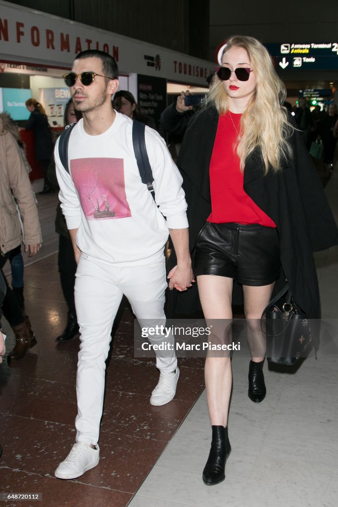 Celebrity Sighting At Paris Airport - Paris Fashion Week Womenswear Fall/Winter 2017/2018