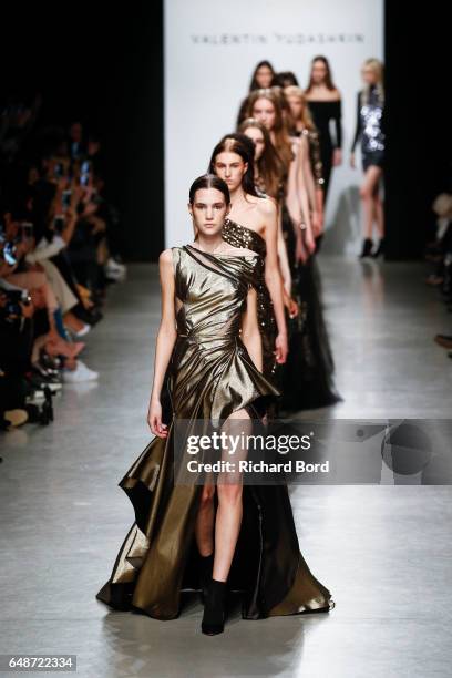 Models walk the runway during the Valentin Yudashkin show at Palais de Tokyo during Paris Fashion Week Womenswear Fall/Winter 2017/2018 on March 6,...