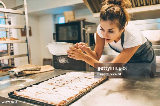 the final touch for the perfect pasrty - flour sifter stock pictures, royalty-free photos & images