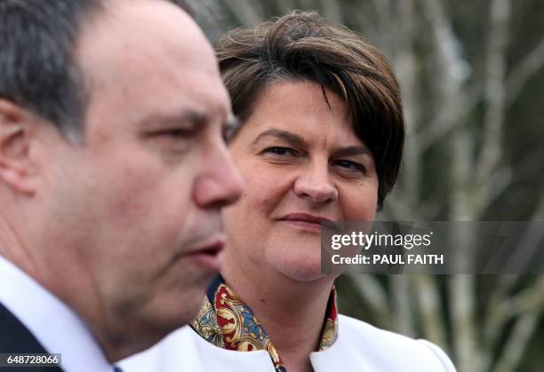 Democratic Unionist Party leader Arlene Foster , and DUP Deputy Leader Nigel Dodds address the media outside the Parliament Buildings at Stormont in...