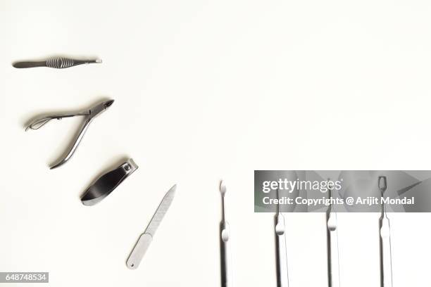 high angle view manicure and pedicure tools on white desk with copy space - eyebrow tweezers stock pictures, royalty-free photos & images