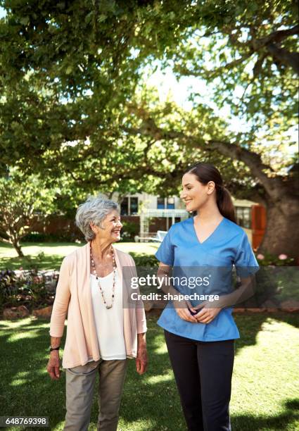 you'll love it here - young woman and senior lady in a park stock pictures, royalty-free photos & images