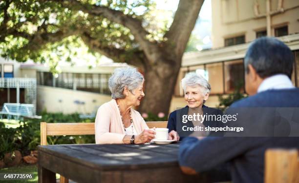 good friends keep the happy times going - retirement community stock pictures, royalty-free photos & images