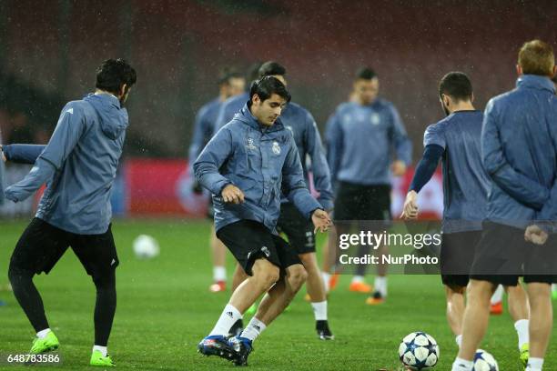 Real Madrid's forward Alvaro Morata during a training session under heavy rain on the eve of the Champions League football match Napoli vs Real...