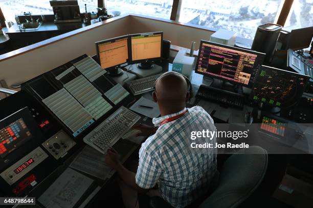 Air traffic controller Emil Watson uses Data Comm, part of the FAA's Next Generation Air Transportation system in the control tower at Miami...