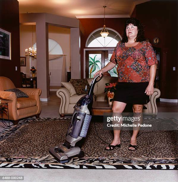 bored housewife vacuuming - bored housewife stock pictures, royalty-free photos & images