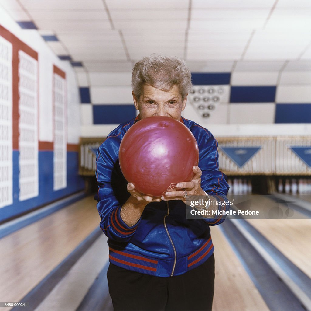 Woman Aiming Bowling Ball