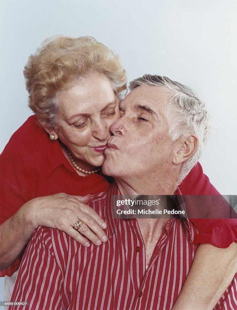 Elderly Couple Kissing