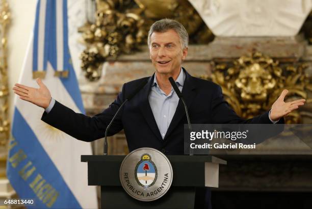 President of Argentina Mauricio Macri gestures during a press conference to announce the opening of biddings for commercial air transport allowing...