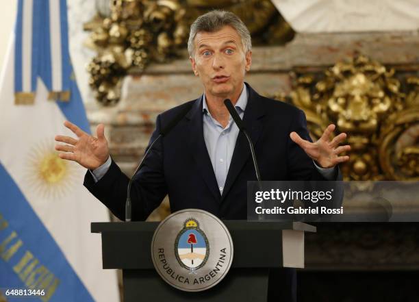 President of Argentina Mauricio Macri gestures during a press conference to announce the opening of biddings for commercial air transport allowing...