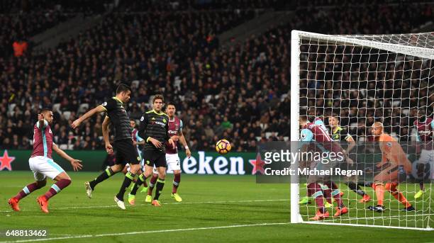 Diego Costa of Chelsea scores his sides second goal during the Premier League match between West Ham United and Chelsea at London Stadium on March 6,...