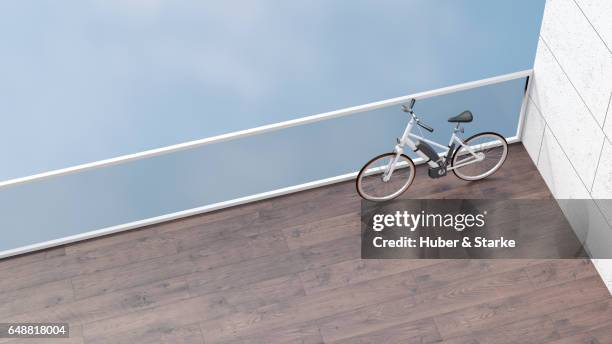 electric bicycle on balcony - architectural detail stock pictures, royalty-free photos & images