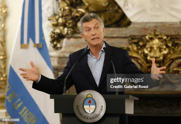 President of Argentina Mauricio Macri gestures during a press conference to announce the opening of biddings for commercial air transport allowing...