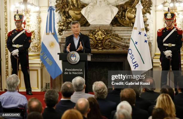 President of Argentina Mauricio Macri gestures during a press conference to announce the opening of biddings for commercial air transport allowing...