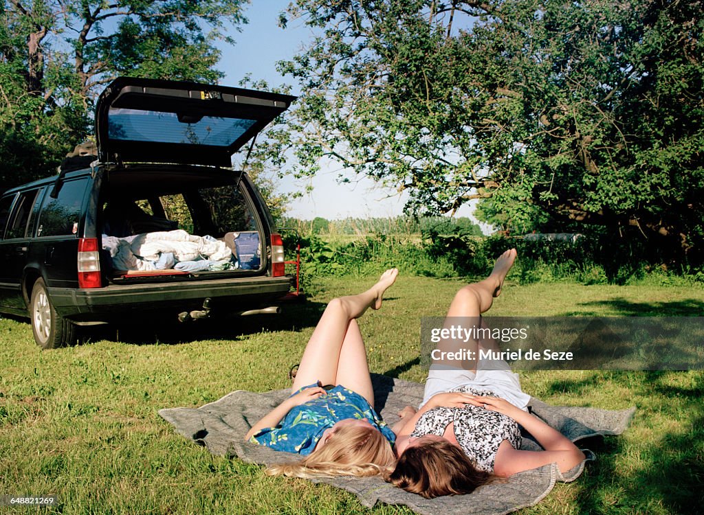 Girls relaxing on grass