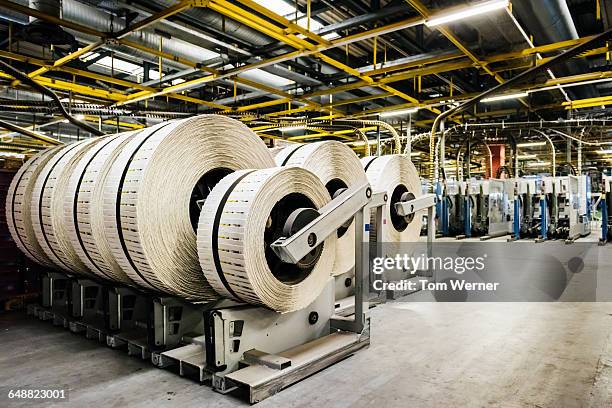 rolls of printed and packed newspapers - paper industry stock pictures, royalty-free photos & images